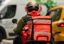 DoorDash driver fueling car at gas station during price surge