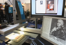 An open book scanner setup used by volunteers to preserve physical books