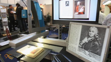 An open book scanner setup used by volunteers to preserve physical books