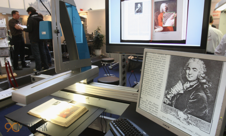 An open book scanner setup used by volunteers to preserve physical books